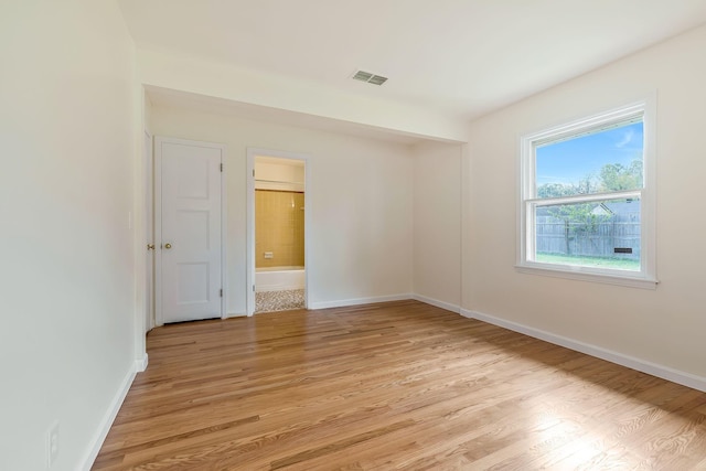 spare room with light wood-type flooring