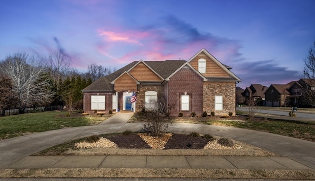 view of property featuring a lawn