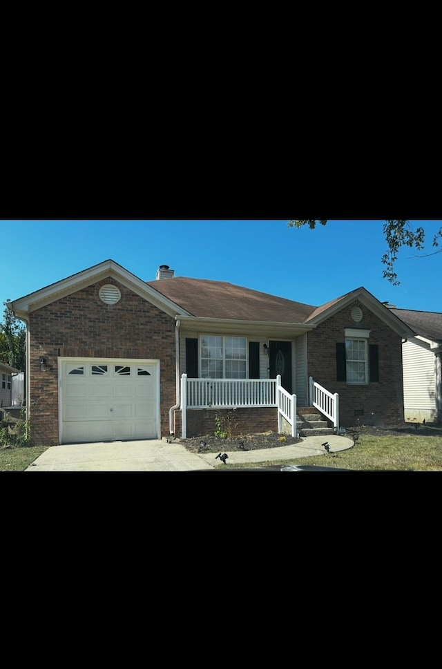 ranch-style house with covered porch and a garage