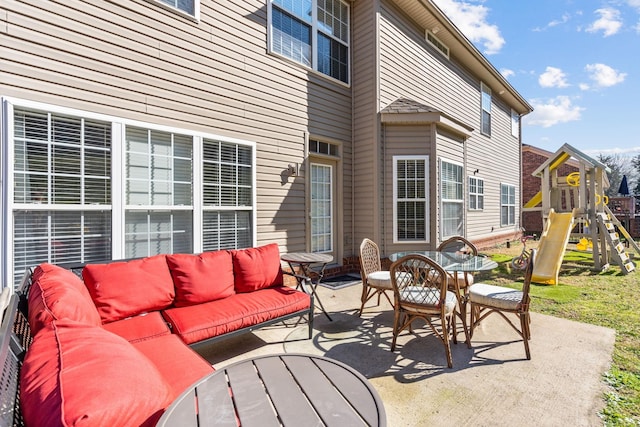 view of patio / terrace with a playground and an outdoor living space