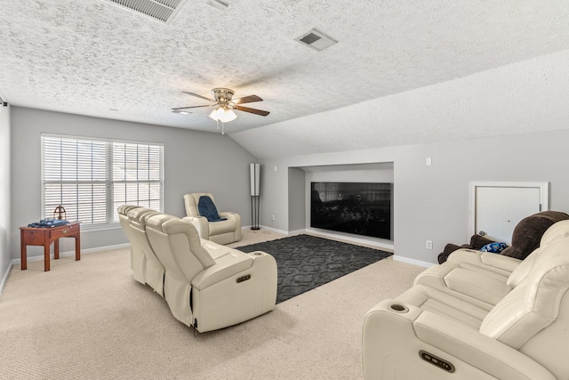 carpeted living room with a textured ceiling, ceiling fan, and lofted ceiling