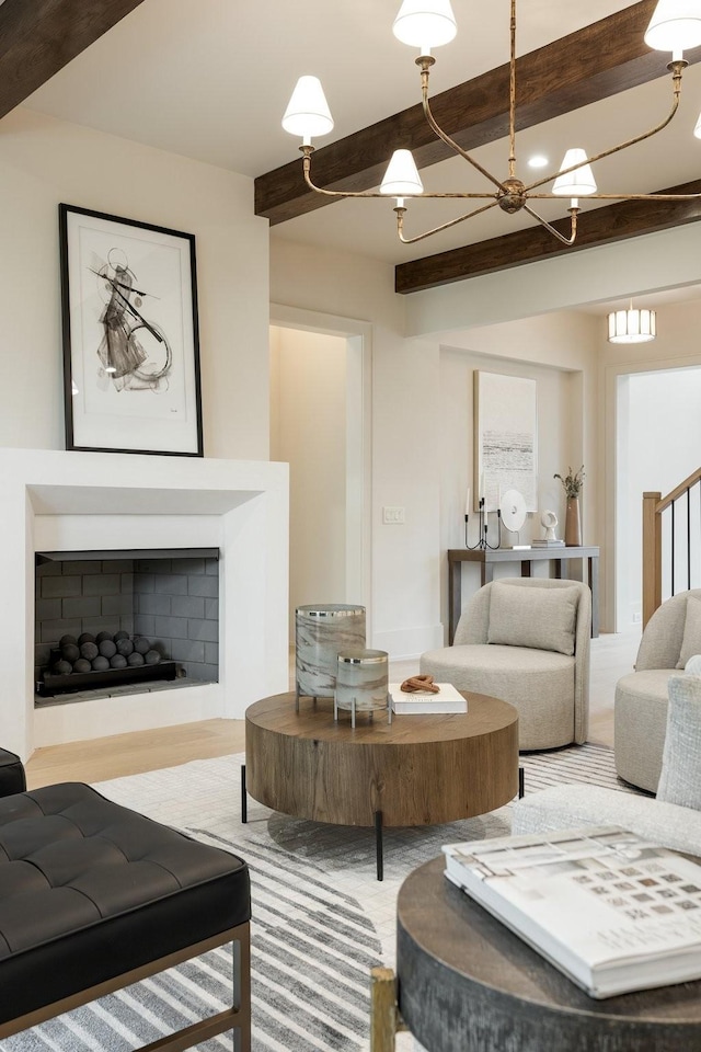 living room featuring beamed ceiling and a chandelier