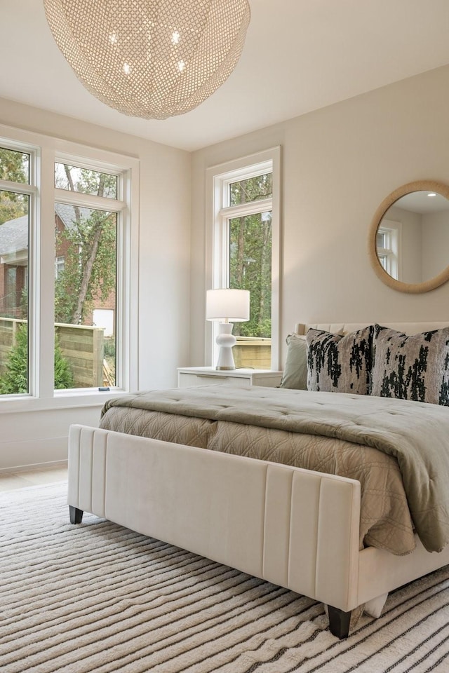 bedroom featuring multiple windows