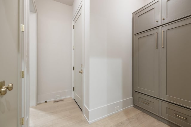 corridor featuring light hardwood / wood-style flooring