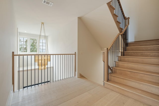 staircase featuring wood-type flooring