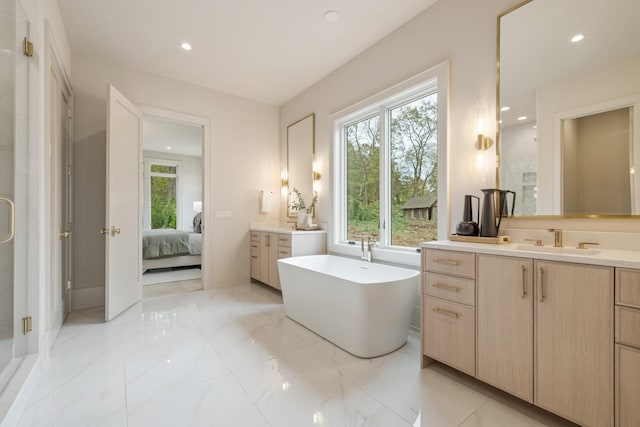 bathroom featuring vanity and plus walk in shower