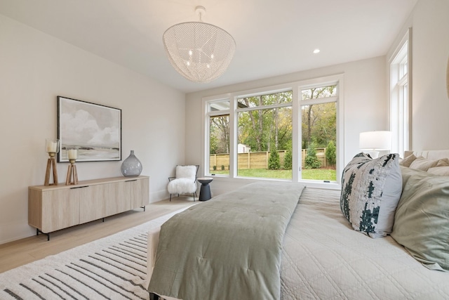 bedroom with light hardwood / wood-style floors