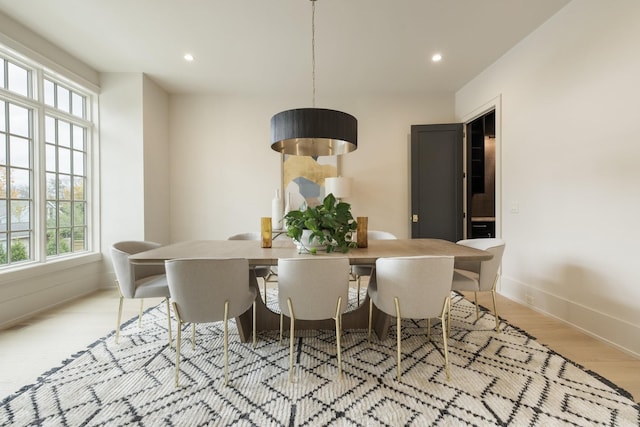 dining space with light wood-type flooring