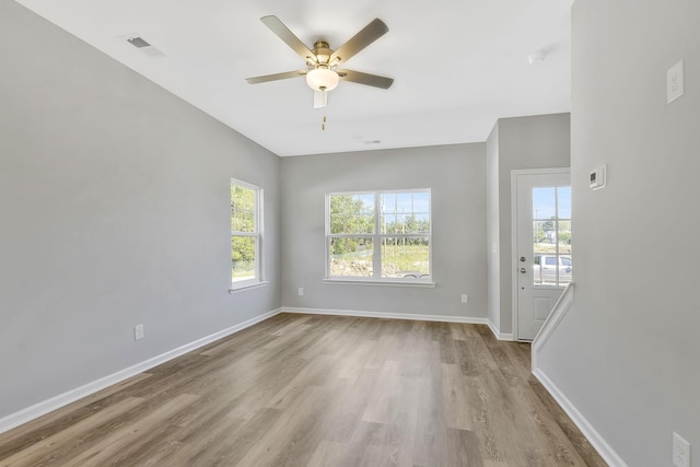 unfurnished room with light hardwood / wood-style flooring and ceiling fan