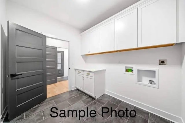 laundry area with washer hookup, cabinet space, baseboards, and electric dryer hookup