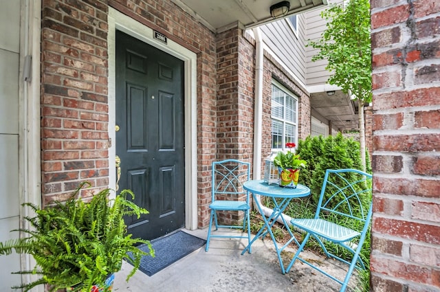 view of exterior entry with covered porch