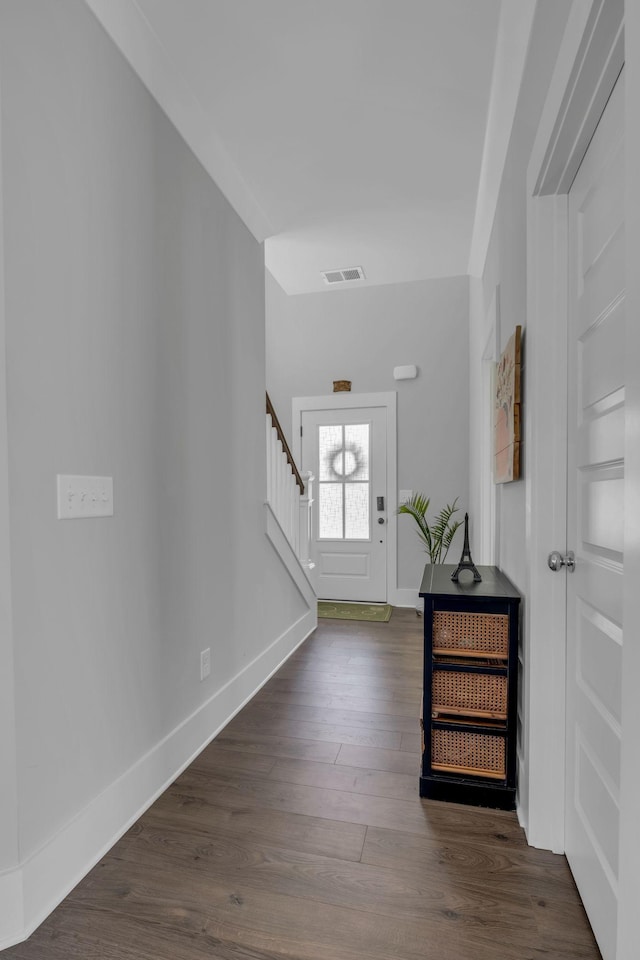 entryway with dark hardwood / wood-style flooring