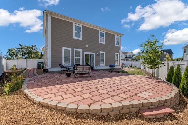 back of property with a patio