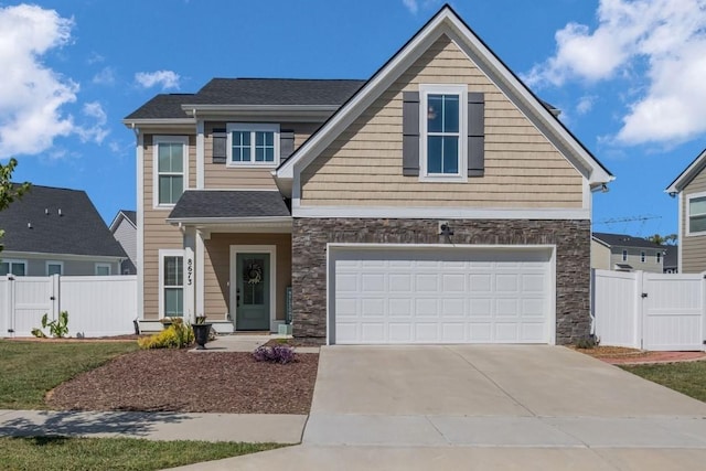 view of front of property with a garage