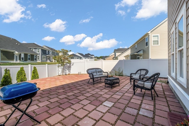 view of patio / terrace with an outdoor fire pit and a grill