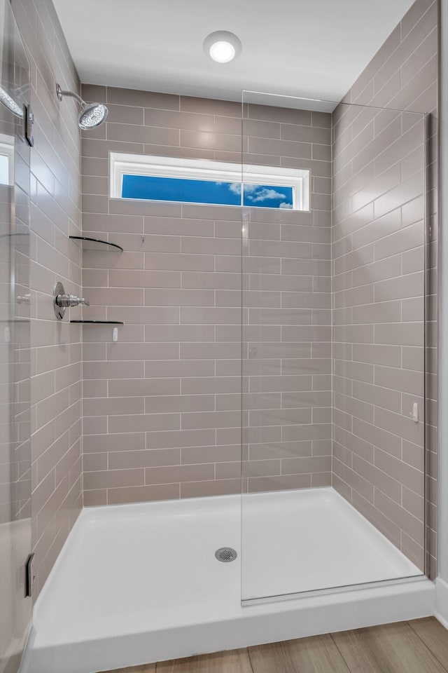 bathroom with a healthy amount of sunlight and walk in shower