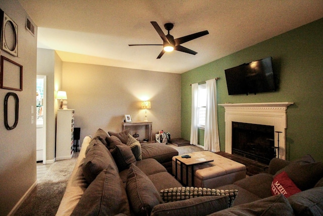 living room with ceiling fan and light carpet