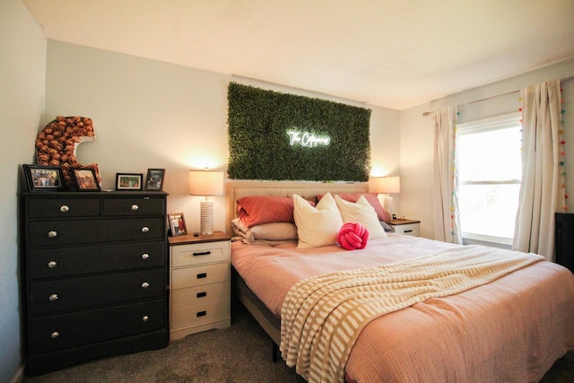 bedroom featuring dark carpet