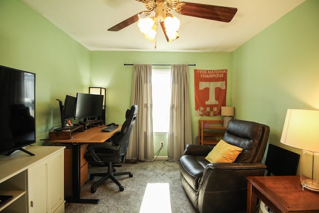 carpeted office featuring ceiling fan