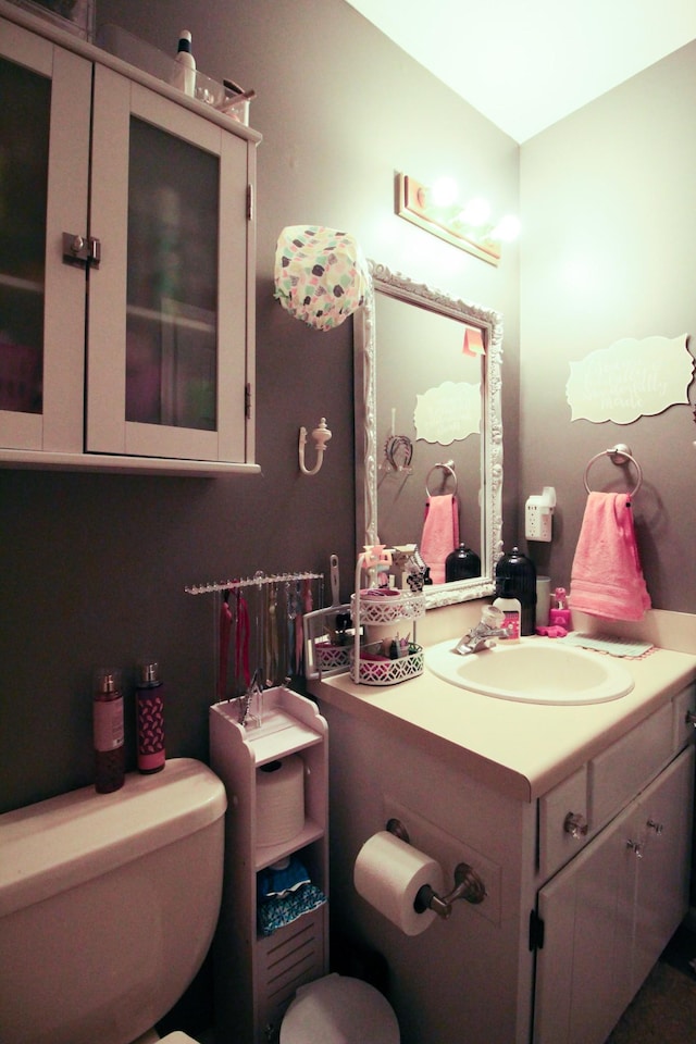 bathroom featuring vanity and toilet