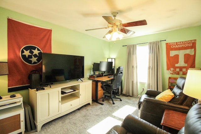 home office featuring light carpet and ceiling fan