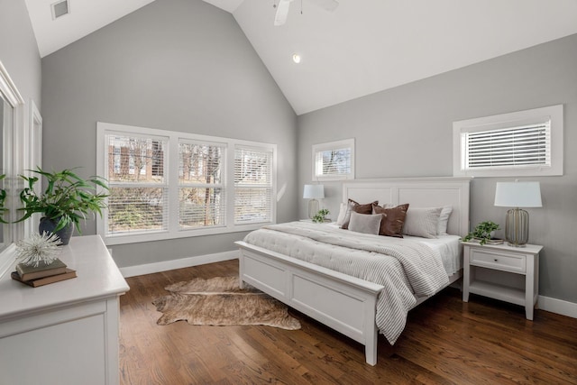 bedroom with ceiling fan, dark hardwood / wood-style flooring, and high vaulted ceiling