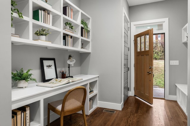 foyer entrance with dark hardwood / wood-style floors