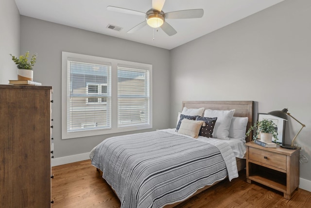 bedroom featuring hardwood / wood-style floors and ceiling fan