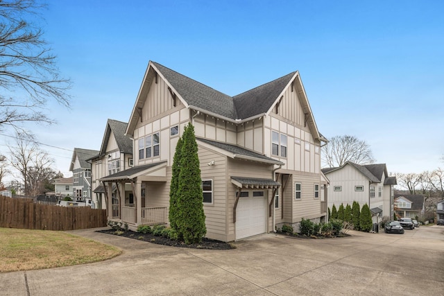 view of side of home with a porch and a garage