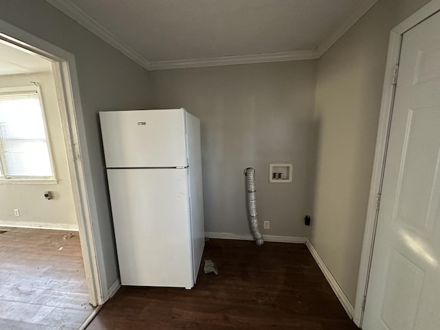 washroom with washer hookup, dark hardwood / wood-style flooring, and crown molding