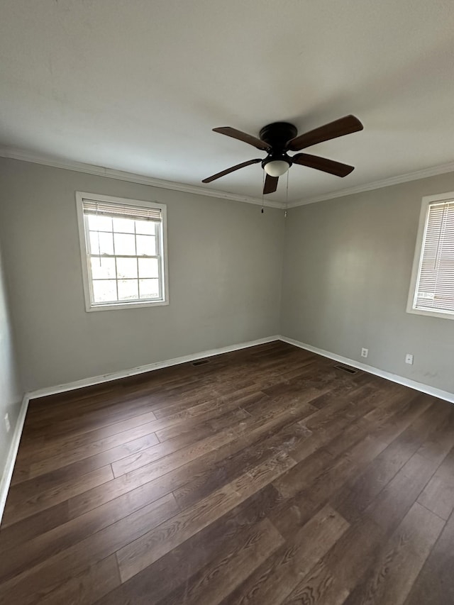 empty room with dark hardwood / wood-style flooring, ceiling fan, and ornamental molding