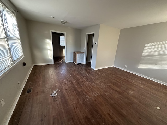 interior space with dark hardwood / wood-style flooring