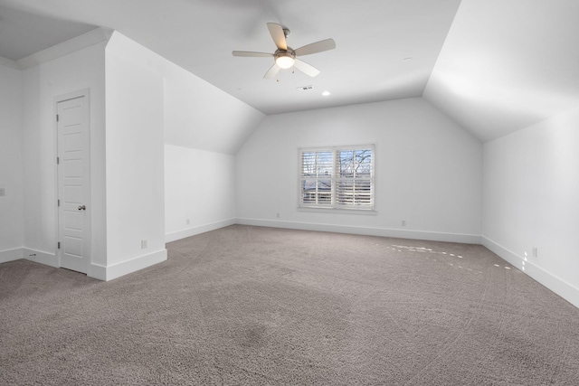 bonus room featuring ceiling fan, carpet floors, and vaulted ceiling