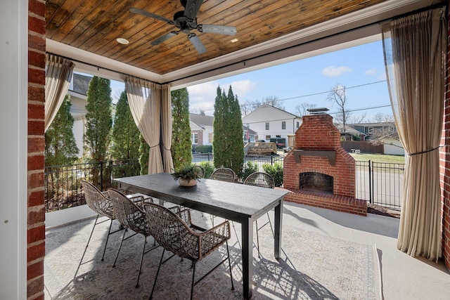 view of patio / terrace with ceiling fan and an outdoor brick fireplace