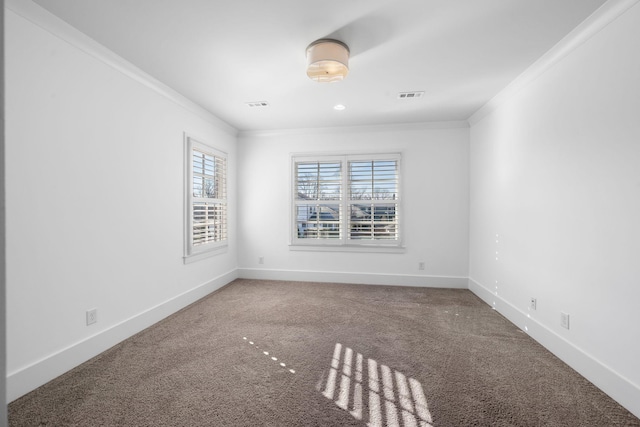 empty room featuring carpet flooring and ornamental molding