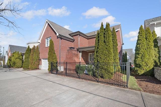 view of side of home featuring a garage