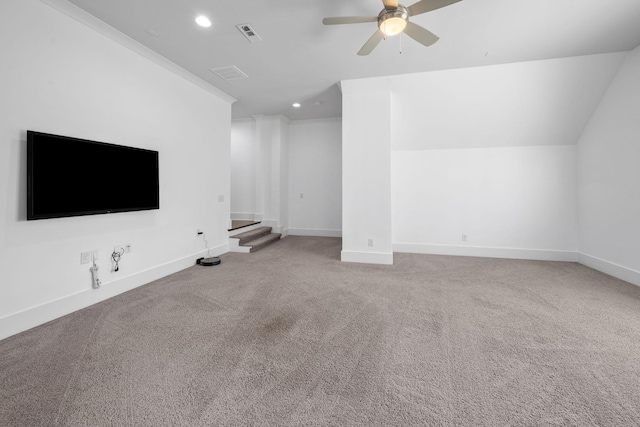 unfurnished living room featuring carpet, vaulted ceiling, and ceiling fan