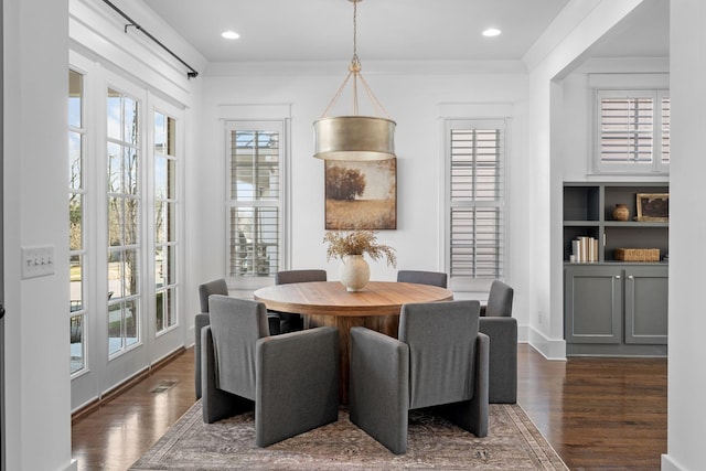 dining space featuring dark hardwood / wood-style flooring