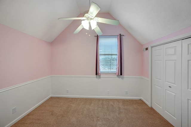 bonus room featuring light carpet, ceiling fan, and vaulted ceiling