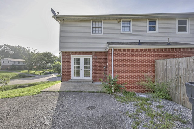 back of property with french doors and a patio area