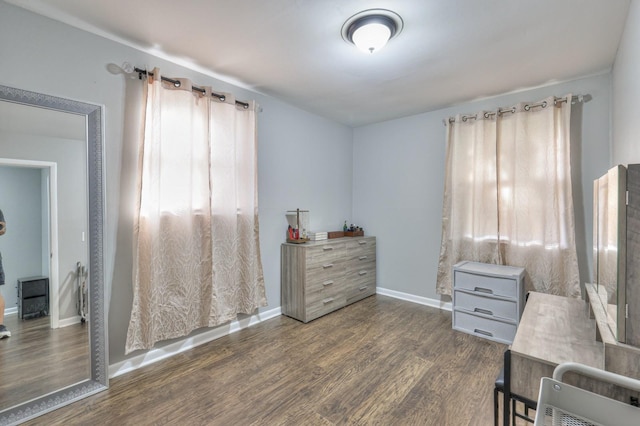 sitting room featuring dark wood-type flooring