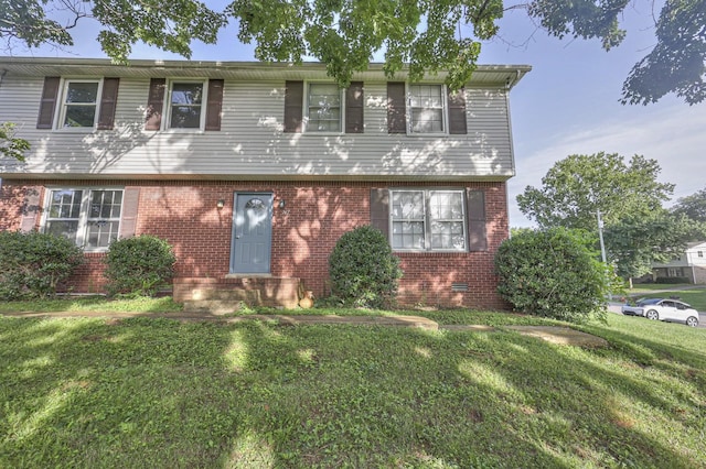 view of front of home with a front yard