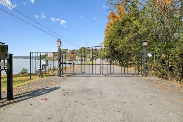 view of gate featuring a water view