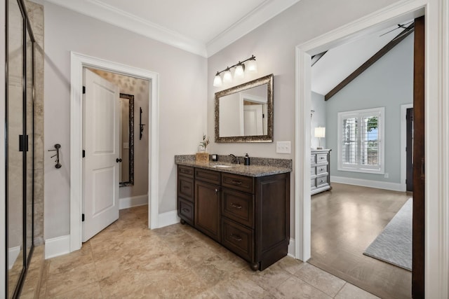 bathroom featuring vanity, vaulted ceiling, ceiling fan, and ornamental molding