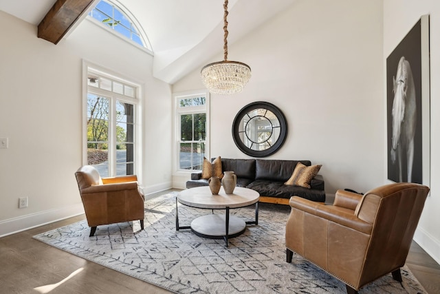 living room with hardwood / wood-style flooring, lofted ceiling with beams, and an inviting chandelier