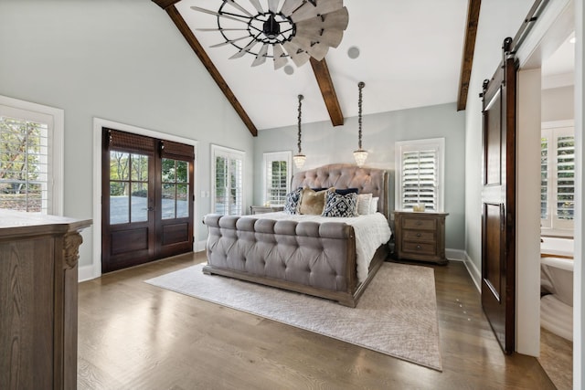 bedroom featuring french doors, dark hardwood / wood-style floors, a barn door, access to exterior, and beam ceiling