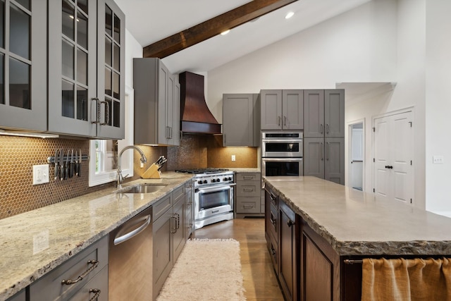 kitchen featuring custom exhaust hood, a center island, sink, vaulted ceiling with beams, and stainless steel appliances