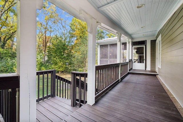 deck with a sunroom