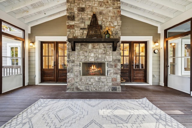 unfurnished living room featuring french doors, beamed ceiling, and dark hardwood / wood-style floors