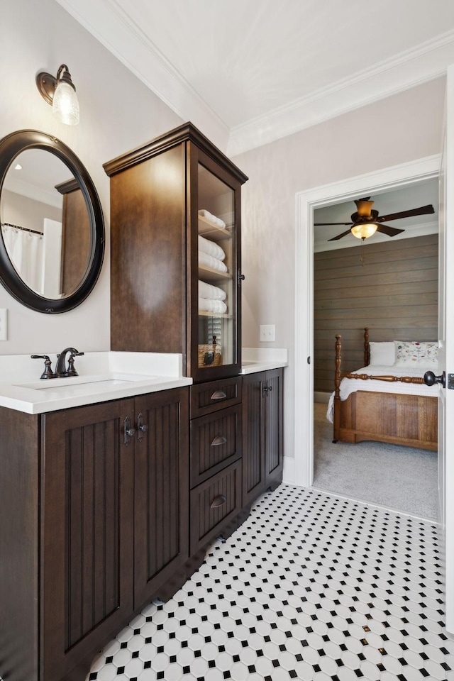 bathroom with vanity, tile patterned floors, ceiling fan, and ornamental molding